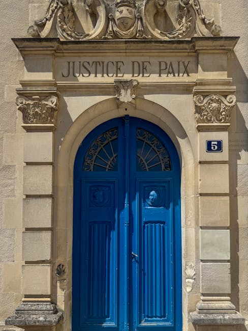 Historical Justice de Paix building entrance with number 5