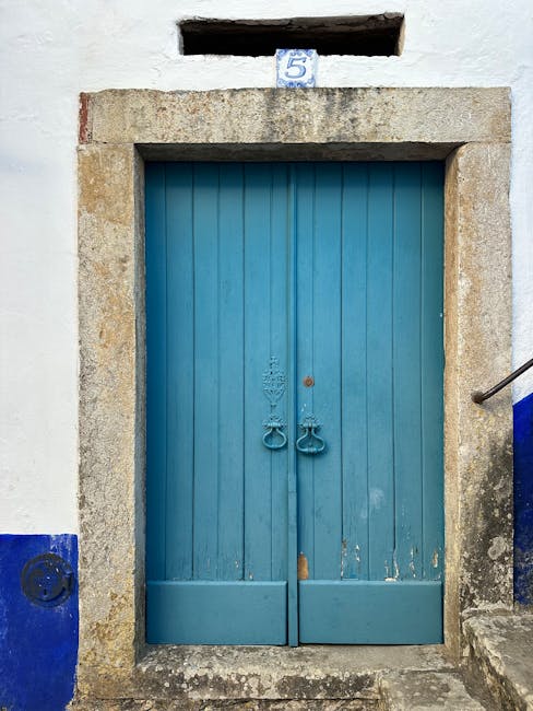 Blue wooden door with number 5 above it